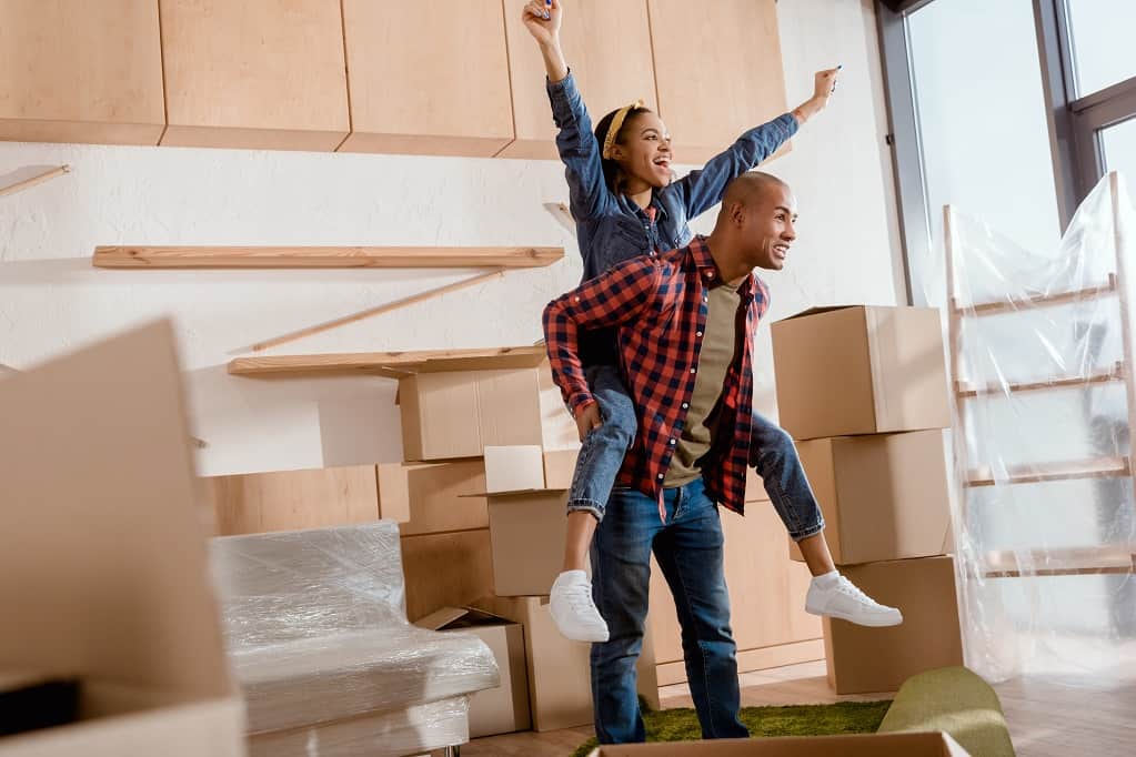 Excited African-american couple piggybacking